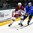 GRAND FORKS, NORTH DAKOTA - APRIL 15: Latvia's Markuss Komuls #2 and Sweden's Isac Lundestrom #17 battle for the puck during preliminary round action at the 2016 IIHF Ice Hockey U18 World Championship. (Photo by Matt Zambonin/HHOF-IIHF Images)

